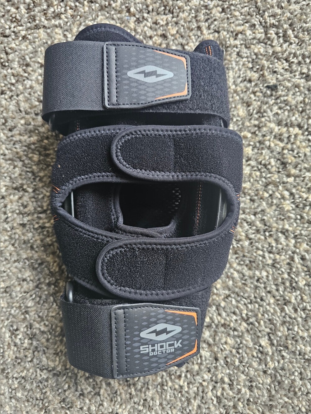 Shock Doctor Dual Wrap Knee Brace with Hinges featuring adjustable